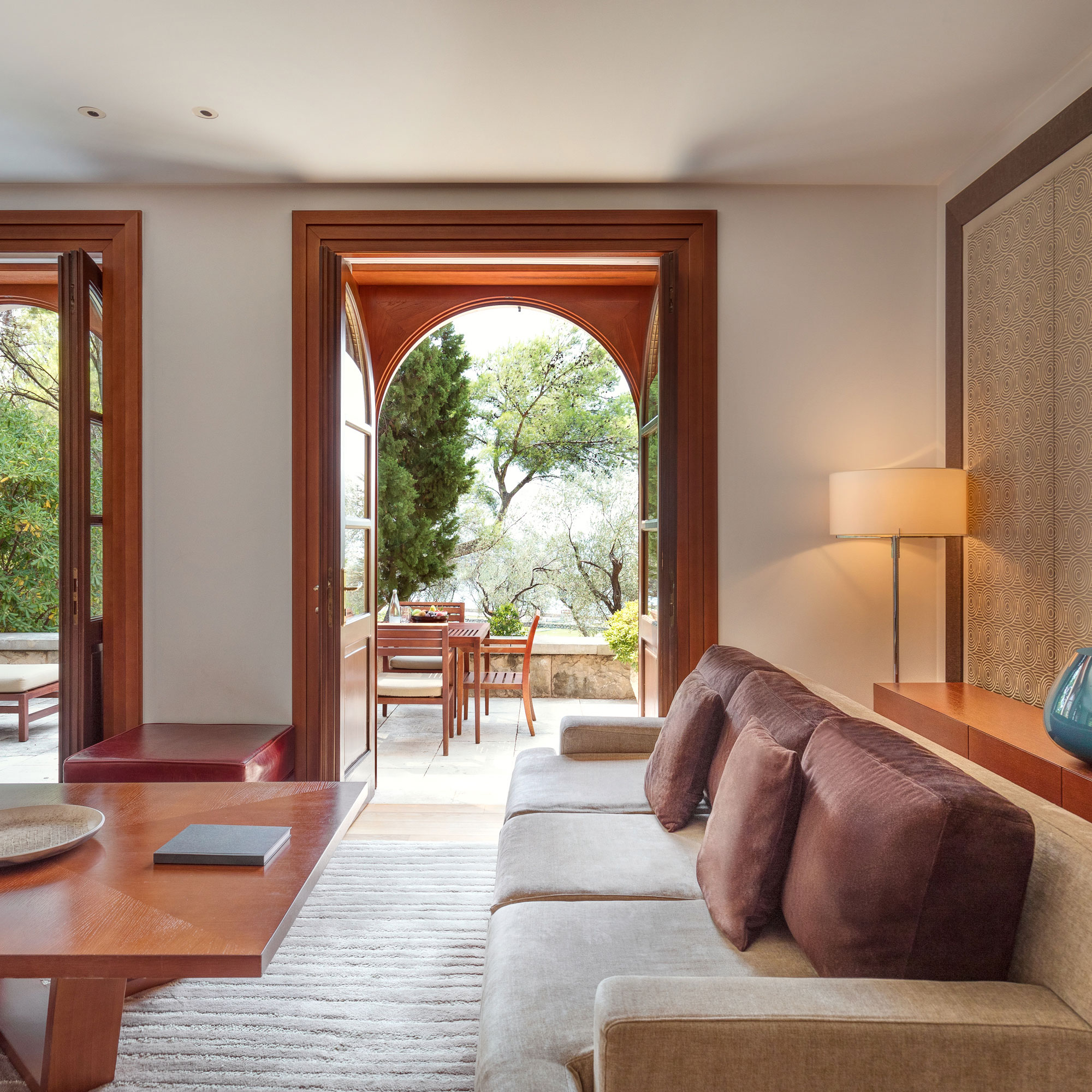 A Villa Miločer sitting room opening to a terrace among the olive trees