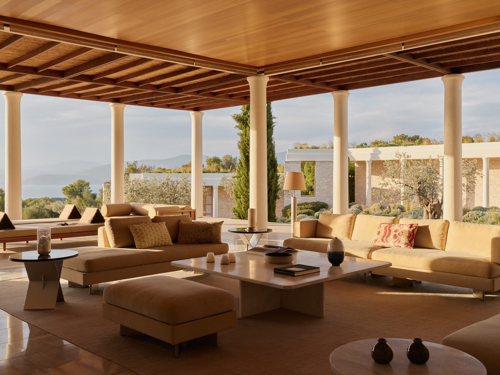 A colonnaded living pavilion open to the olive groves