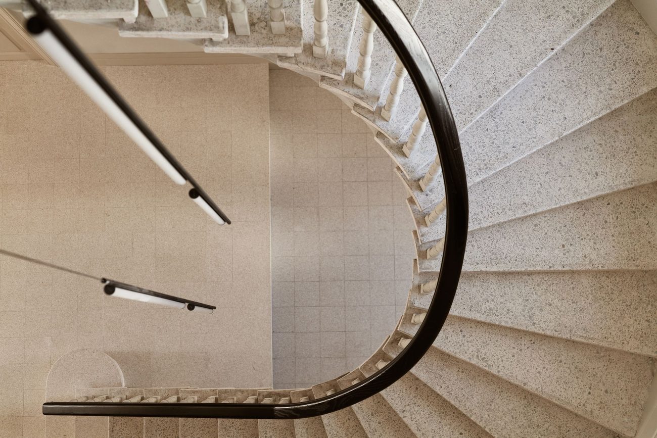 The original stone staircase winding through the house