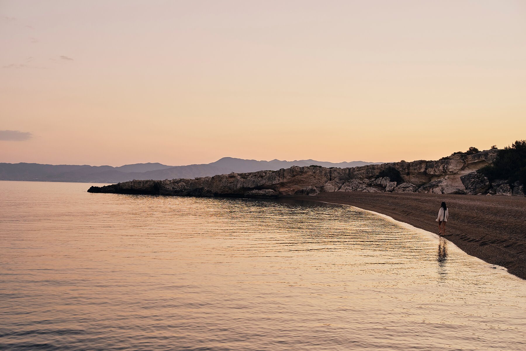 The quiet sand beach on Chrysochous Bay at dusk