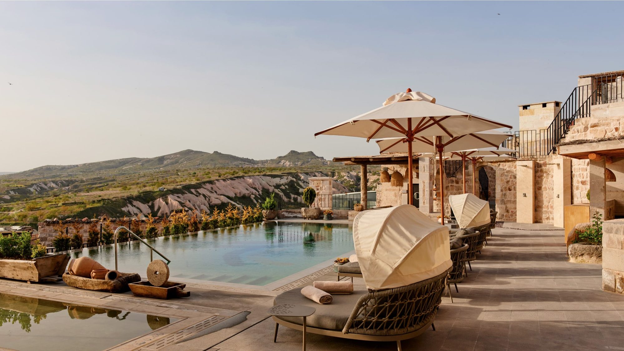 The outdoor pool on a terrace above the valley