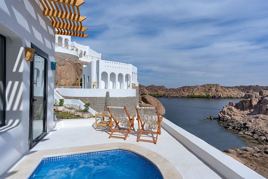A private terrace with a plunge pool above the granite boulders and the Nile