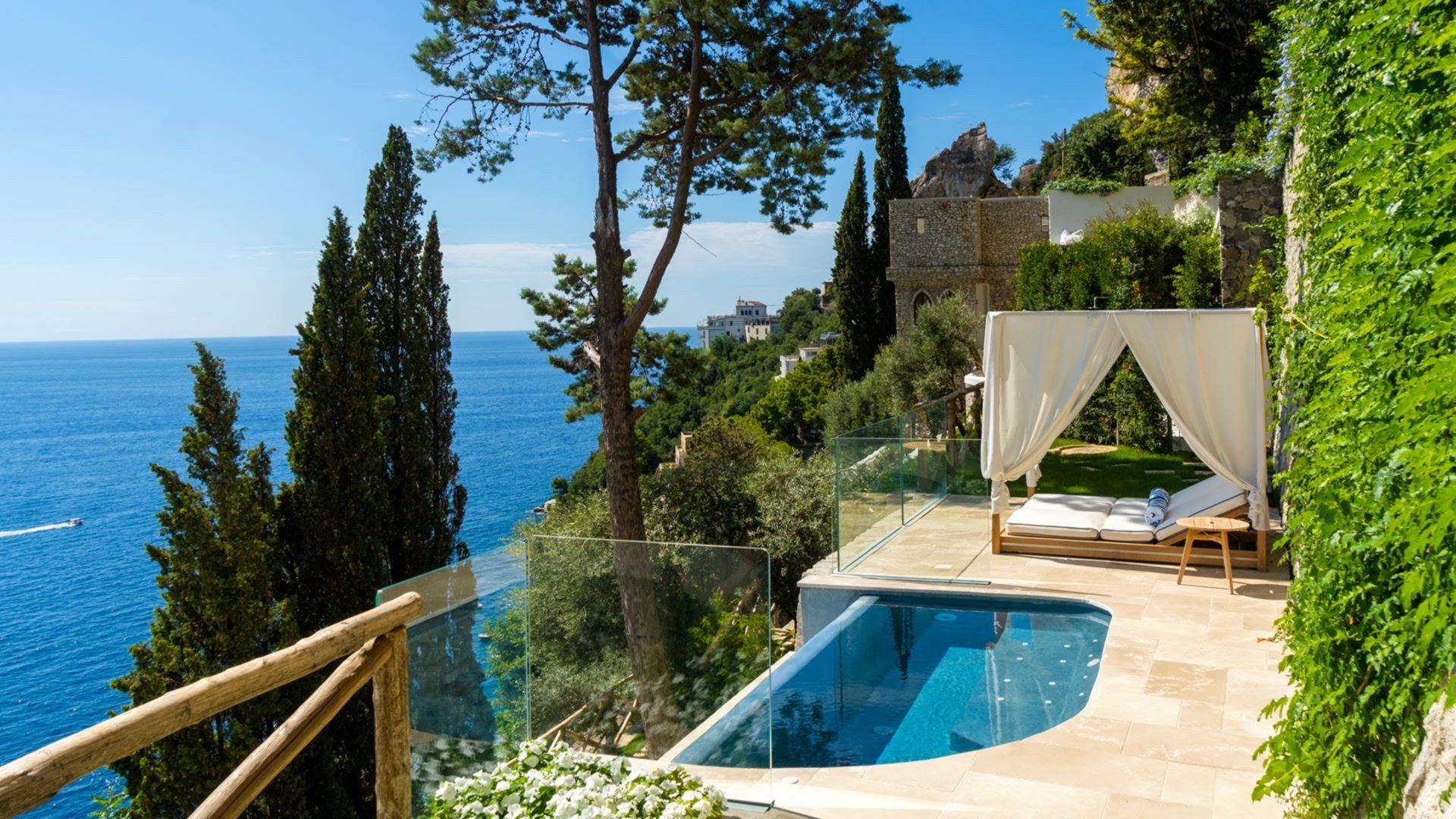 A sea-facing suite with hand-painted Vietri tiles and mid-century furniture