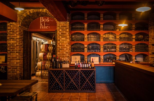 The Boškinac cellar, lined with the estate's own bottles