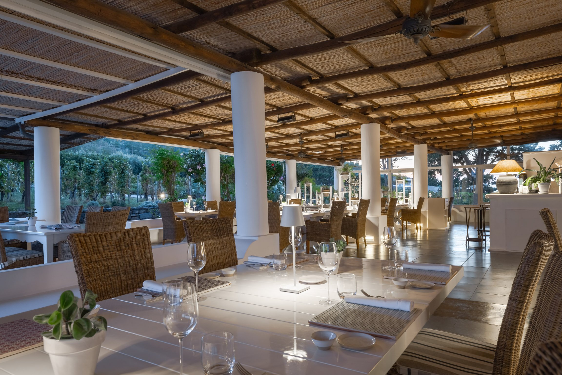 The dining room at Sira under a beamed ceiling