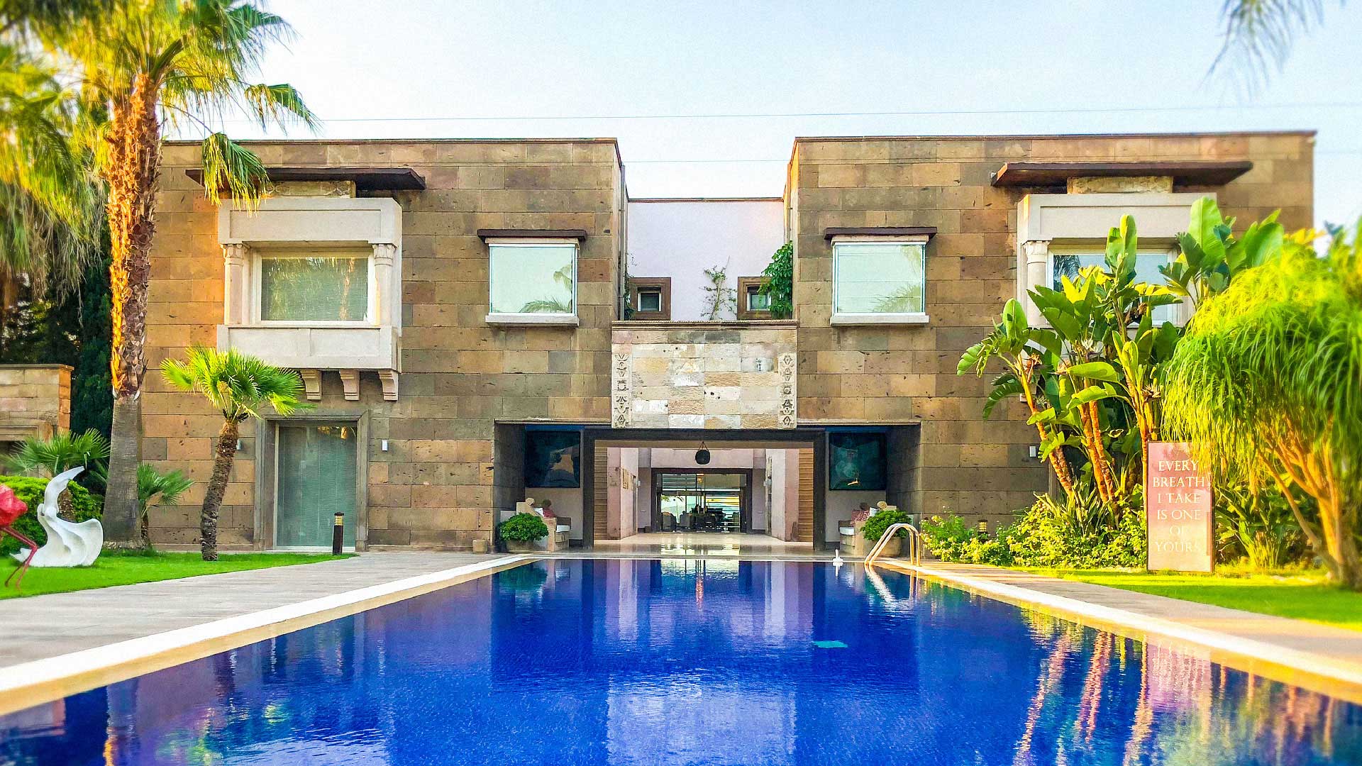 The stone house and its garden pool