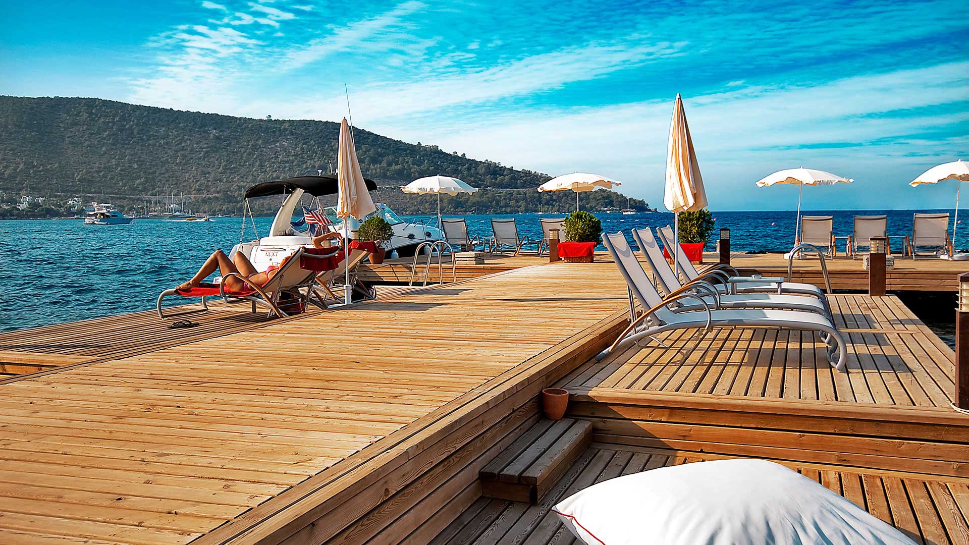 The timber deck reaching out over the Aegean