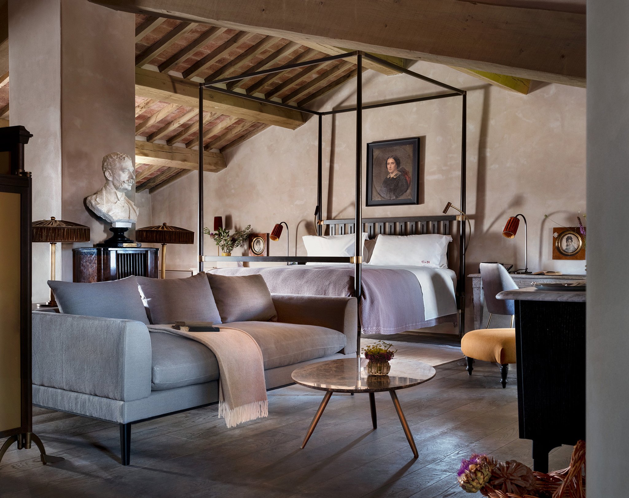 A castle suite with beamed ceilings, antique furniture and shuttered windows