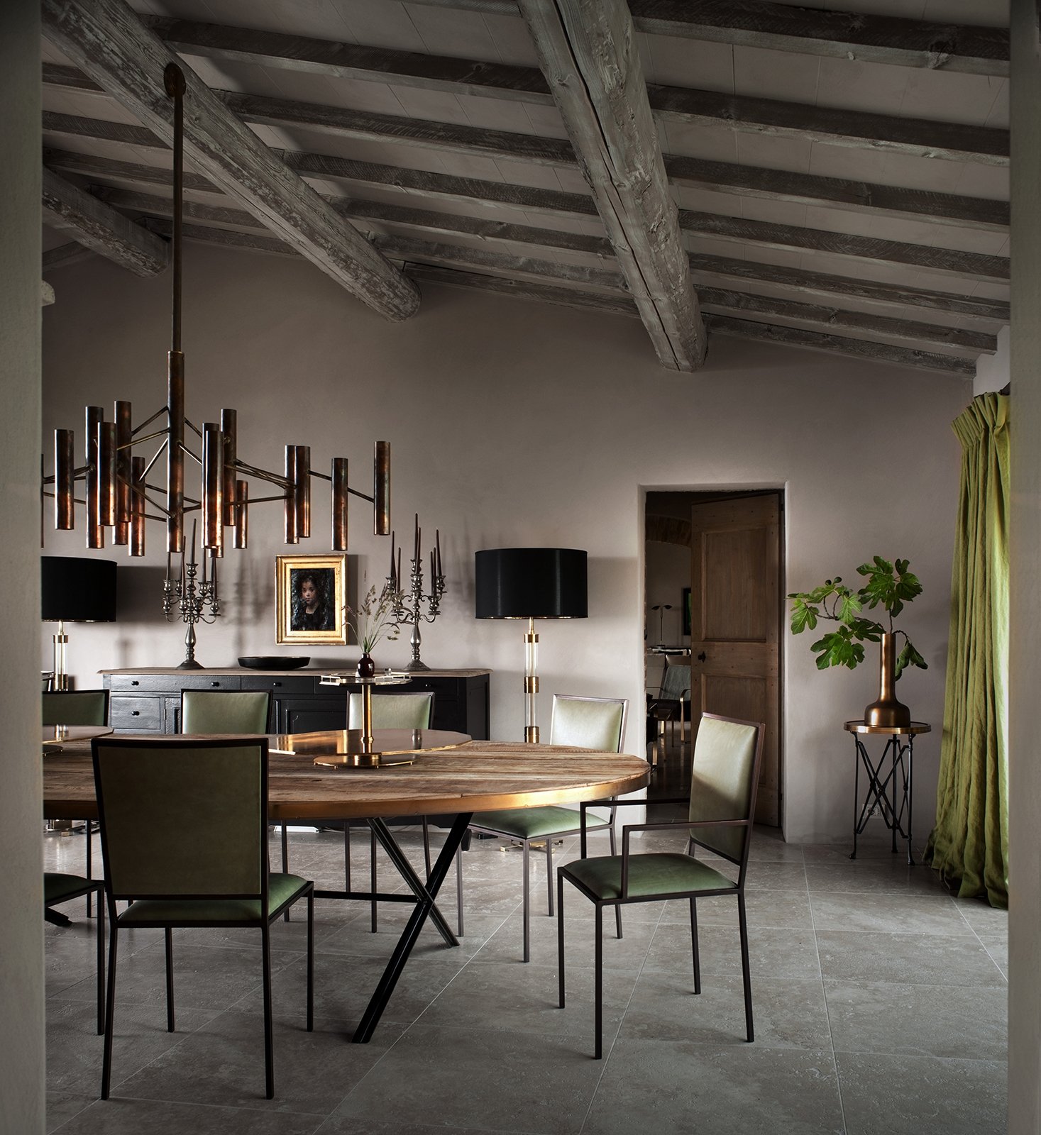 An interior detail, bespoke furniture and worn stone against soft light