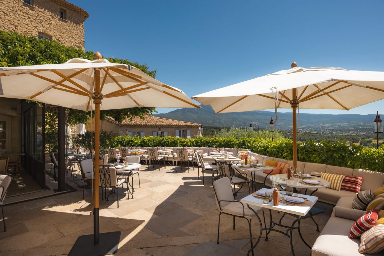 Tables set on the terrace of La Table du Ventoux, with Mont Ventoux beyond