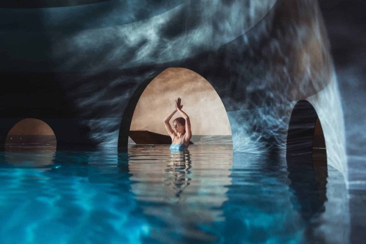 The arched grottos of the Sphere Pool, thermal water lit from within