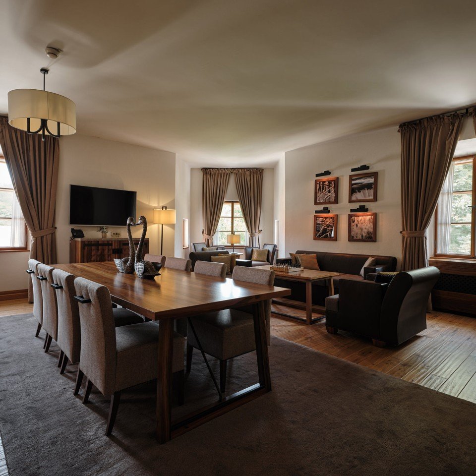 The royal suite's living room with a long walnut table
