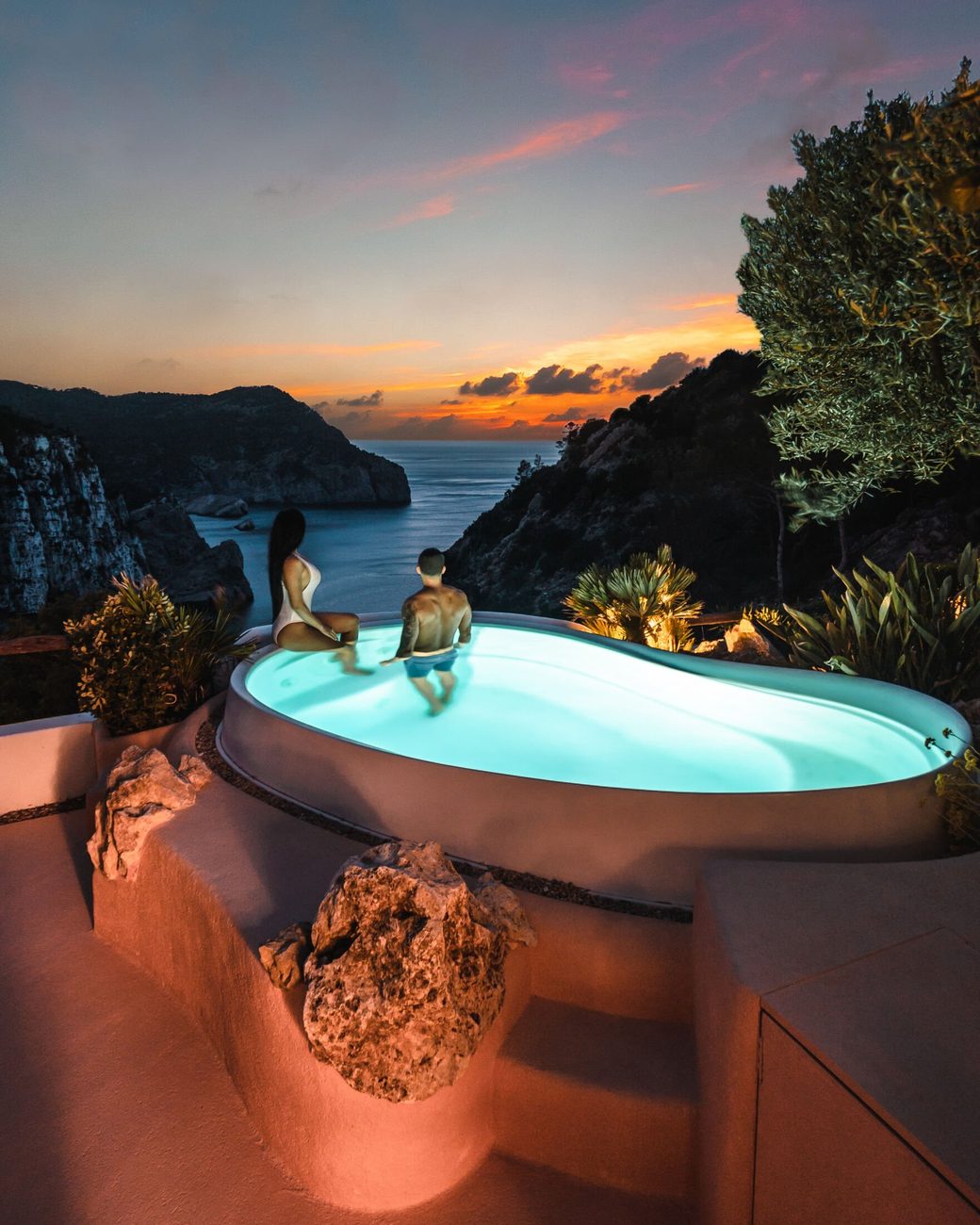 The Cascadas Suspendidas, heated seawater pools falling down the cliff at sunset