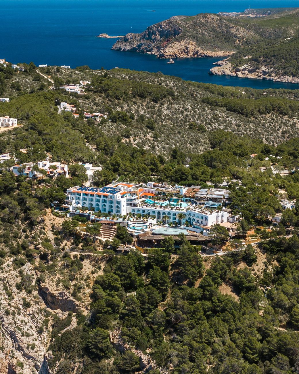 The hotel on its pine headland above the bay of San Miguel