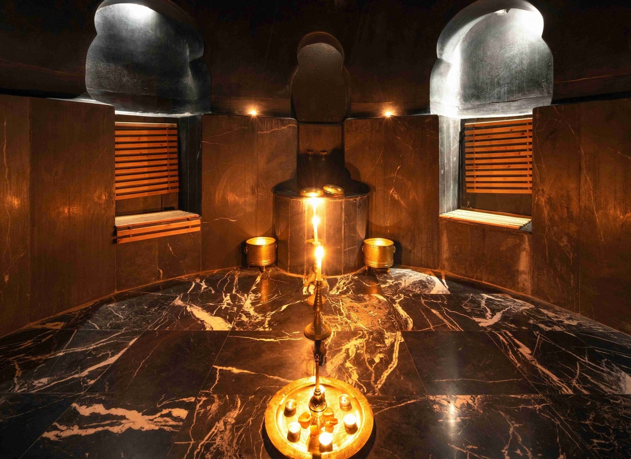 The candlelit hammam in dark marble