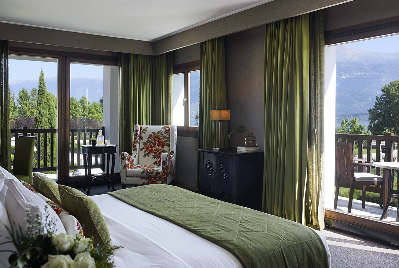 A lake-view room with a balcony over the gardens