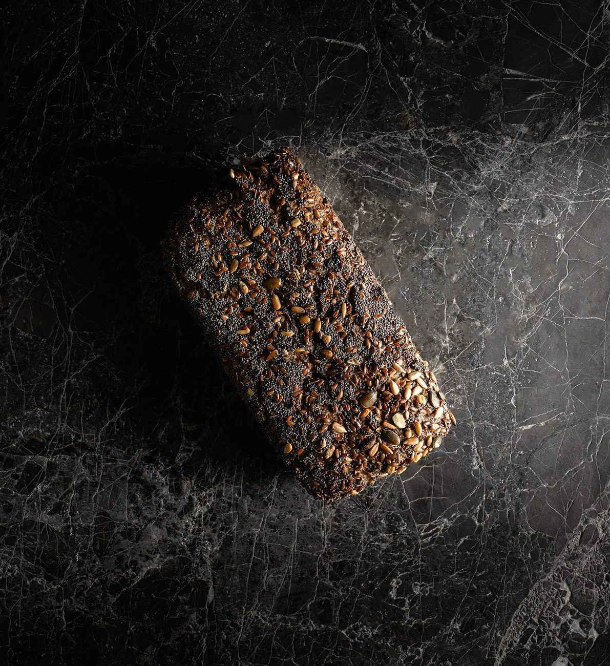 A dark, seeded ancient-grain loaf