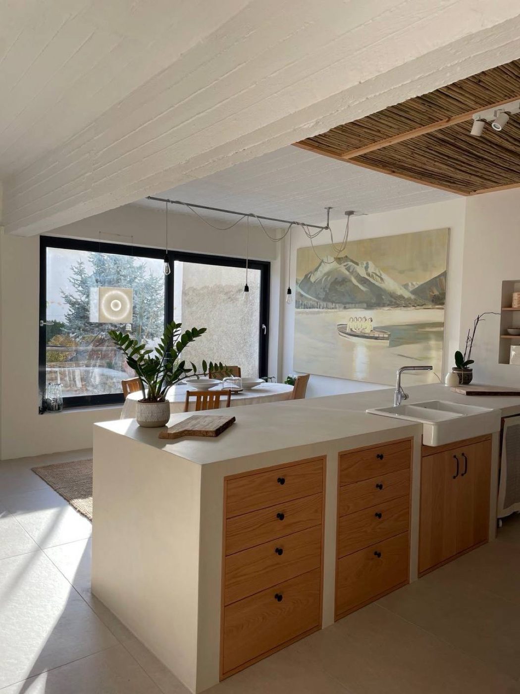 The kitchen island and a window table looking out to the garden