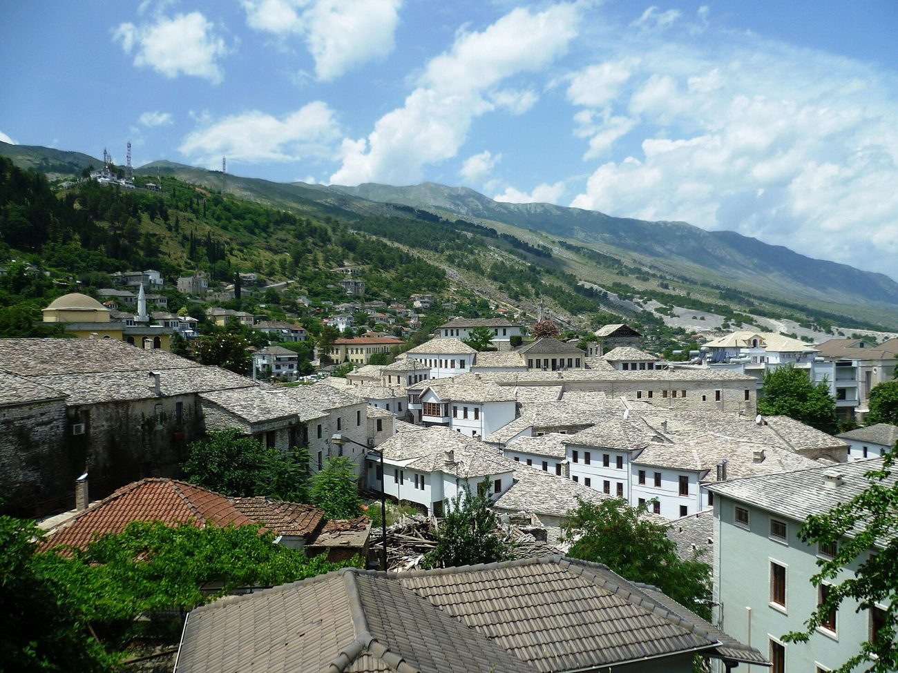 Slate roofs of Gjirokastër stacked up the hillside