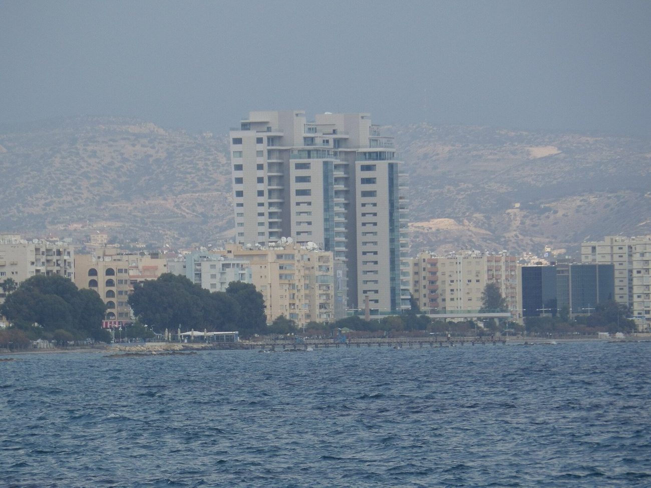 The twin Trilogy towers above the Limassol seafront