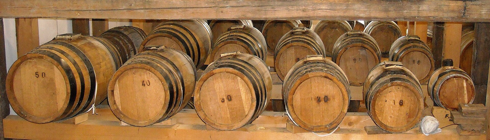 A batteria of balsamic vinegar casks in decreasing sizes