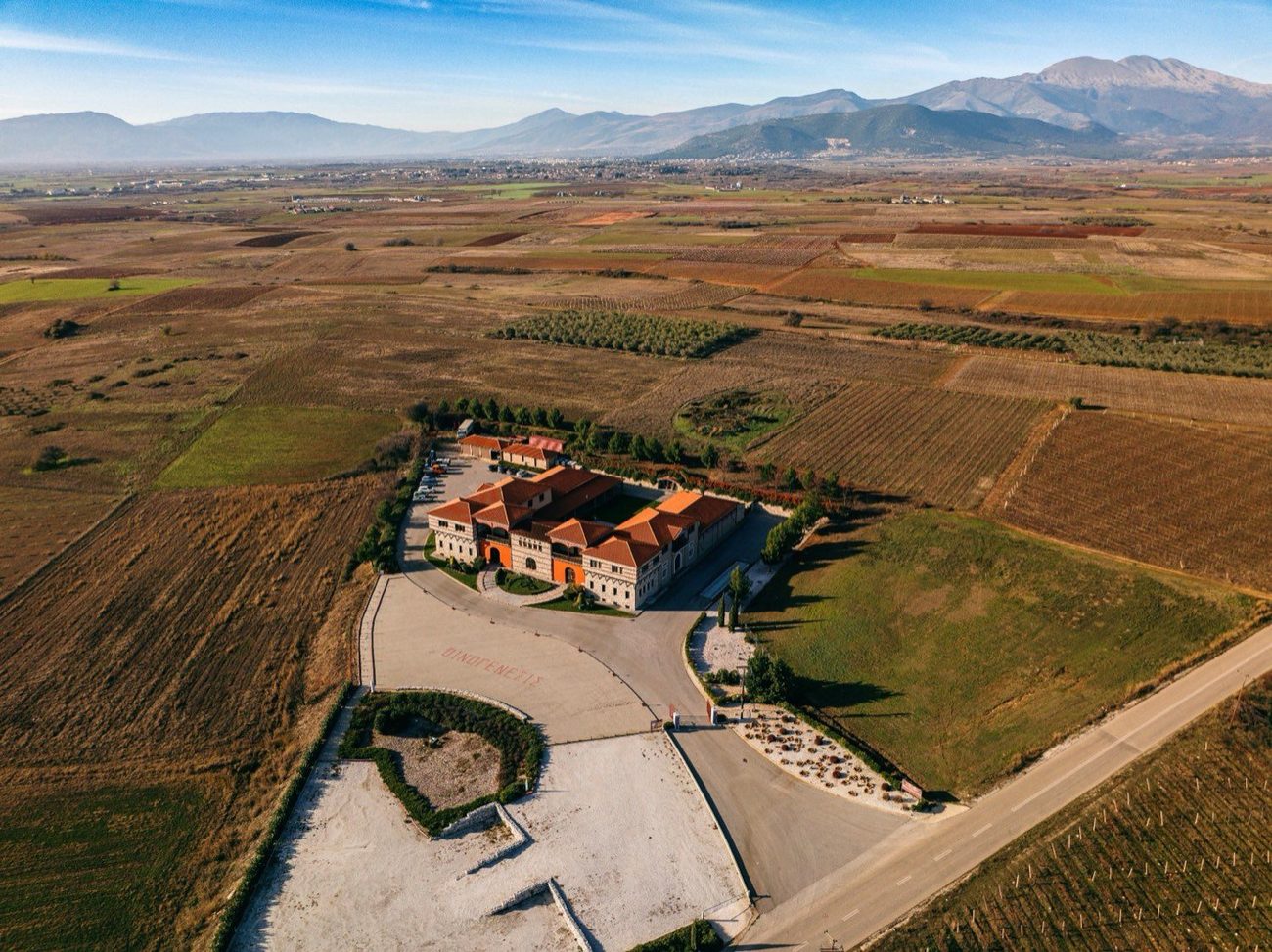 The Oenogenesis winery in the Drama plain, beneath the mountains