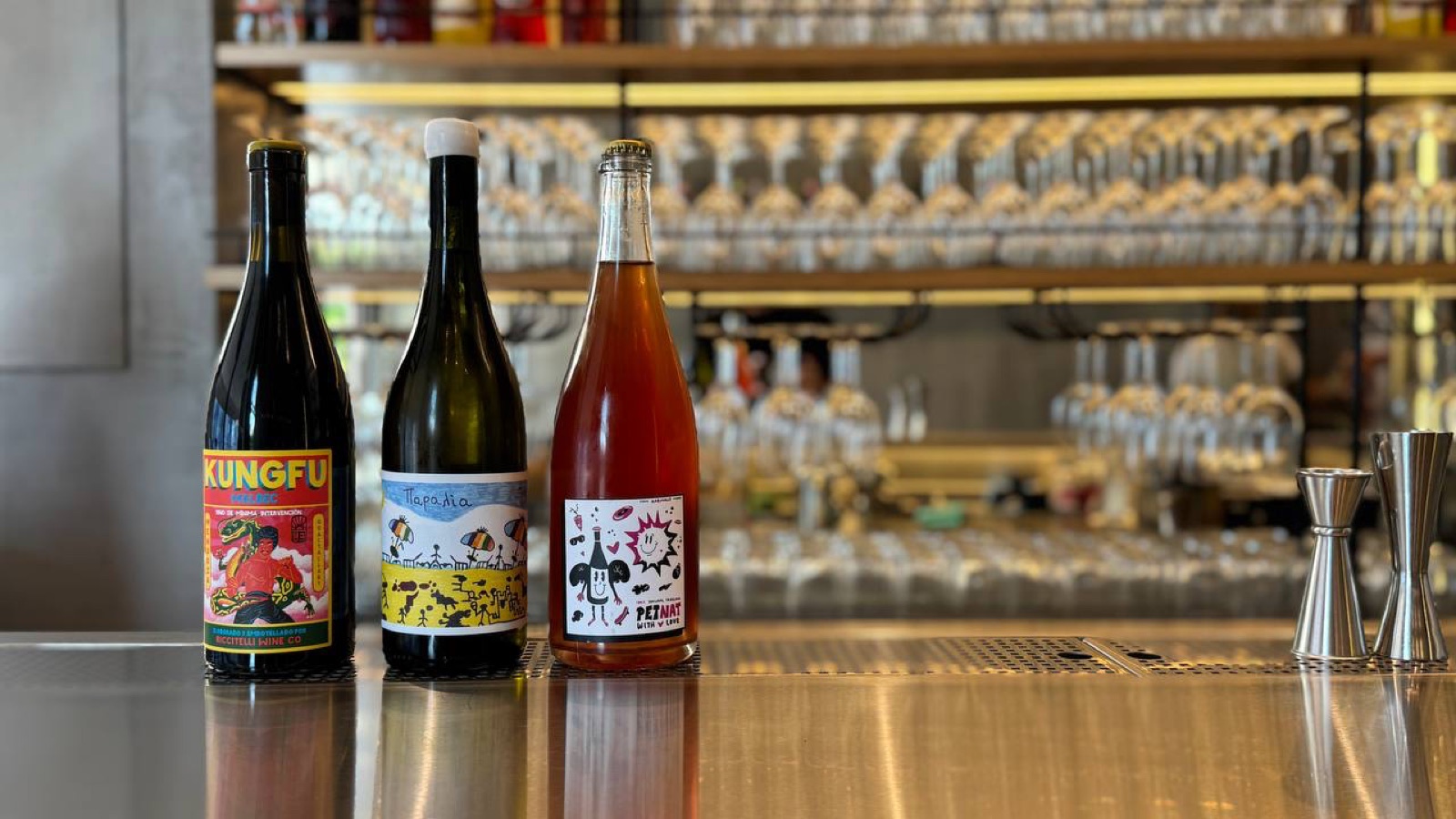 A natural-wine bar by the Peristeri metro, where the Kika team pours to a Milanese clock.