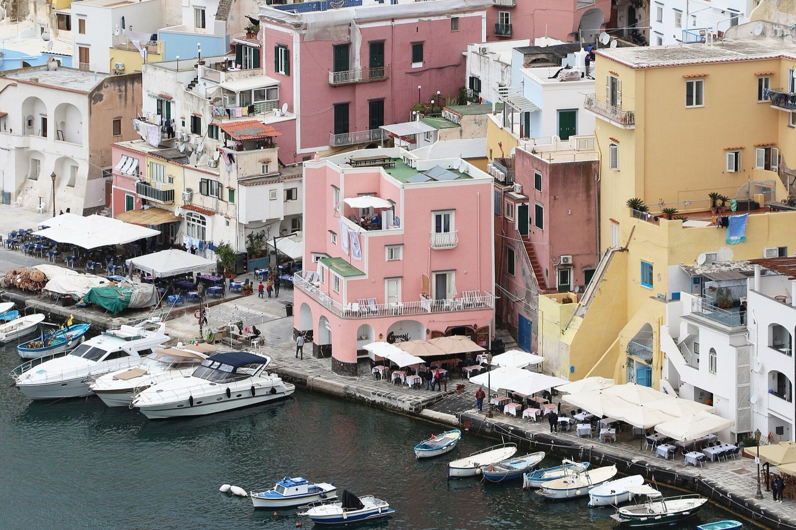 Painted fishermen's houses stacked above the water at Marina Corricella, Procida