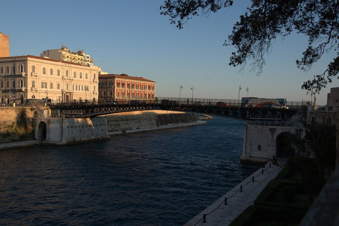 The navigable canal between Taranto's two seas at golden hour