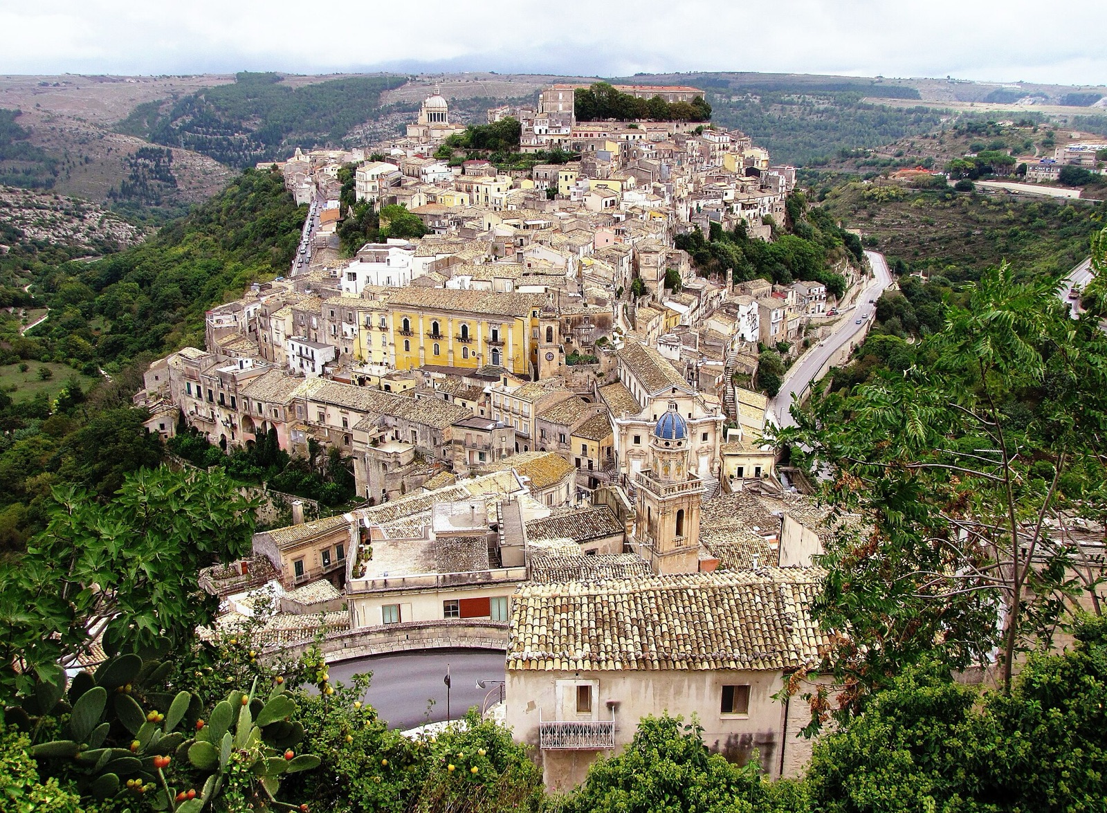 The old town of Ragusa Ibla stacked on its spur, the dome of San Giorgio rising above the baroque roofline
