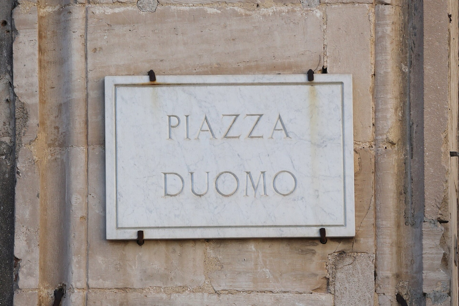 Piazza del Duomo in Catania with the elephant fountain and its two-tone baroque facades