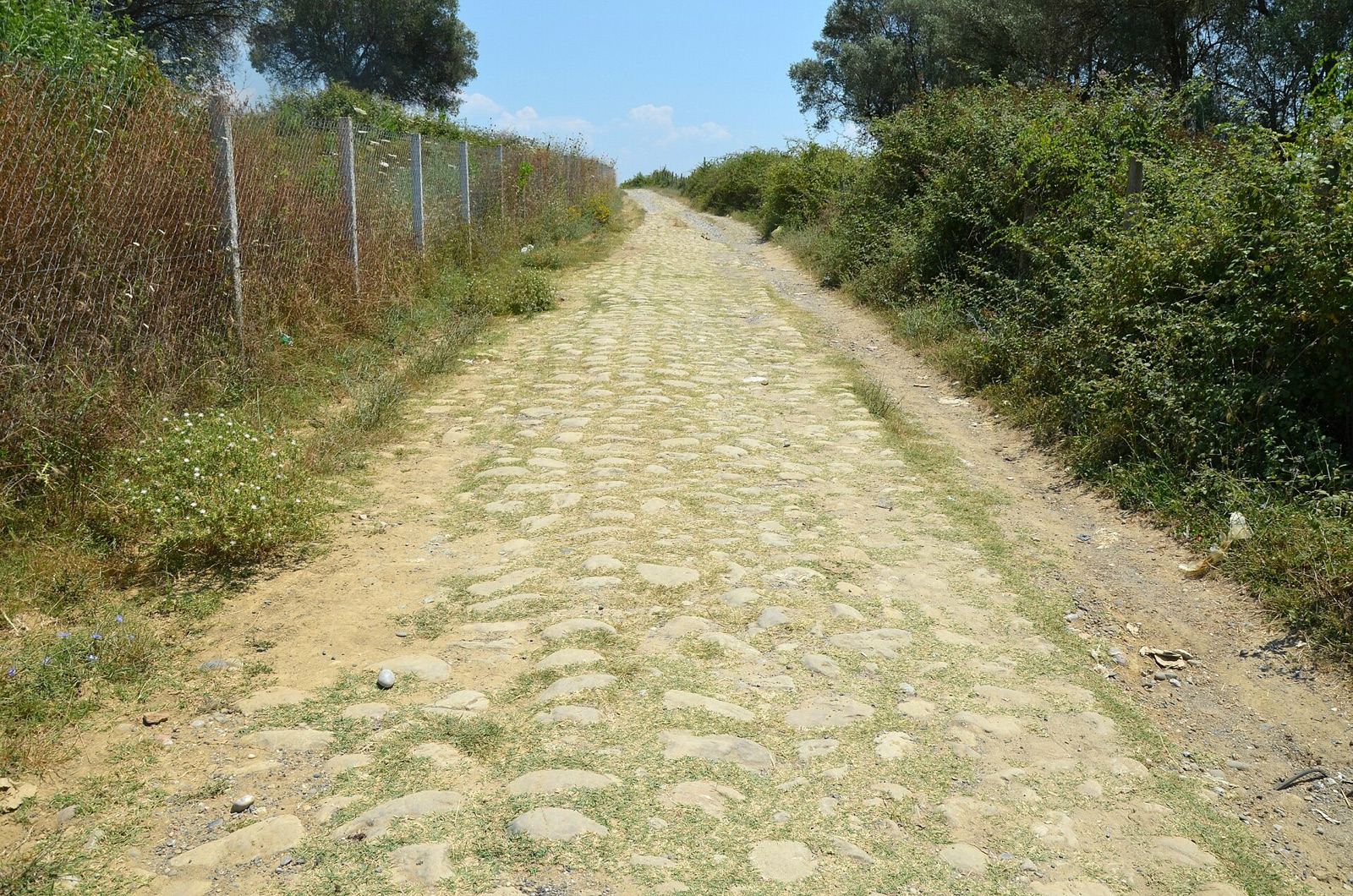 Bare Roman paving of the Via Egnatia in open country near Peqin, Albania