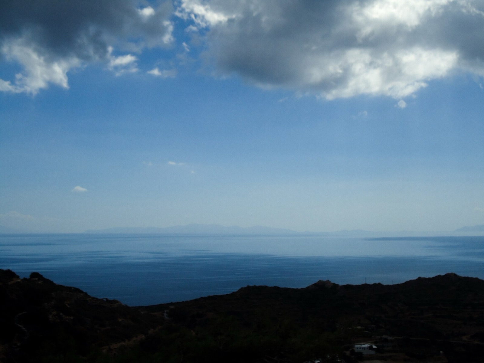 The bare, terraced islands read as timeless. The bareness is a wound, and it is several th