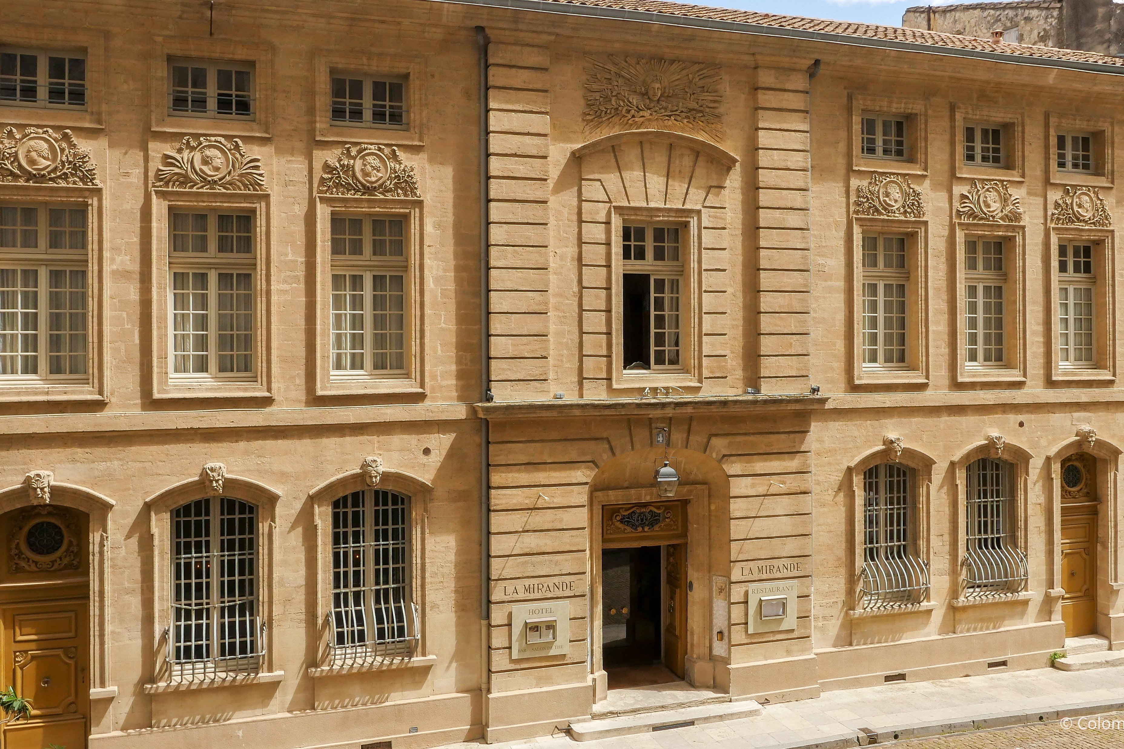 The carved stone facade of La Mirande on place de l'Amirande