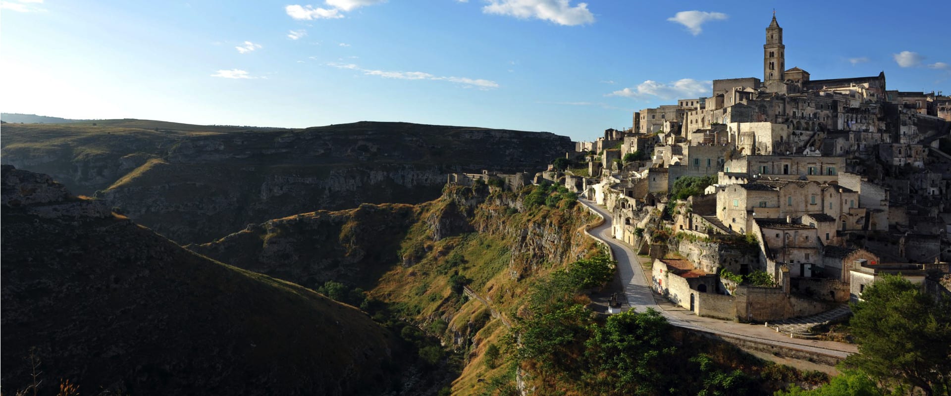 Matera's Sassi and cathedral above the Gravina ravine at first light