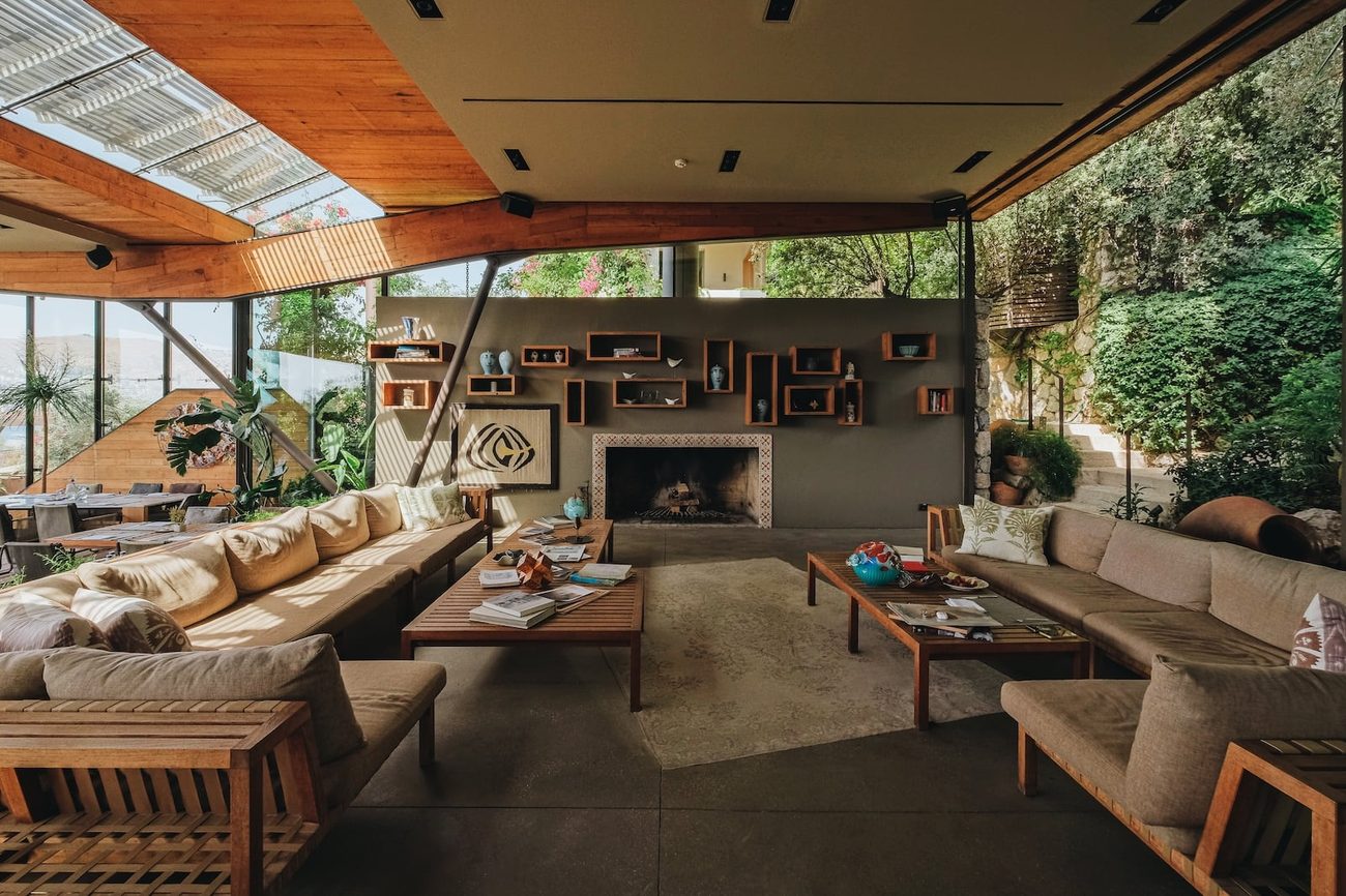A shaded lounge of pale linen and warm wood