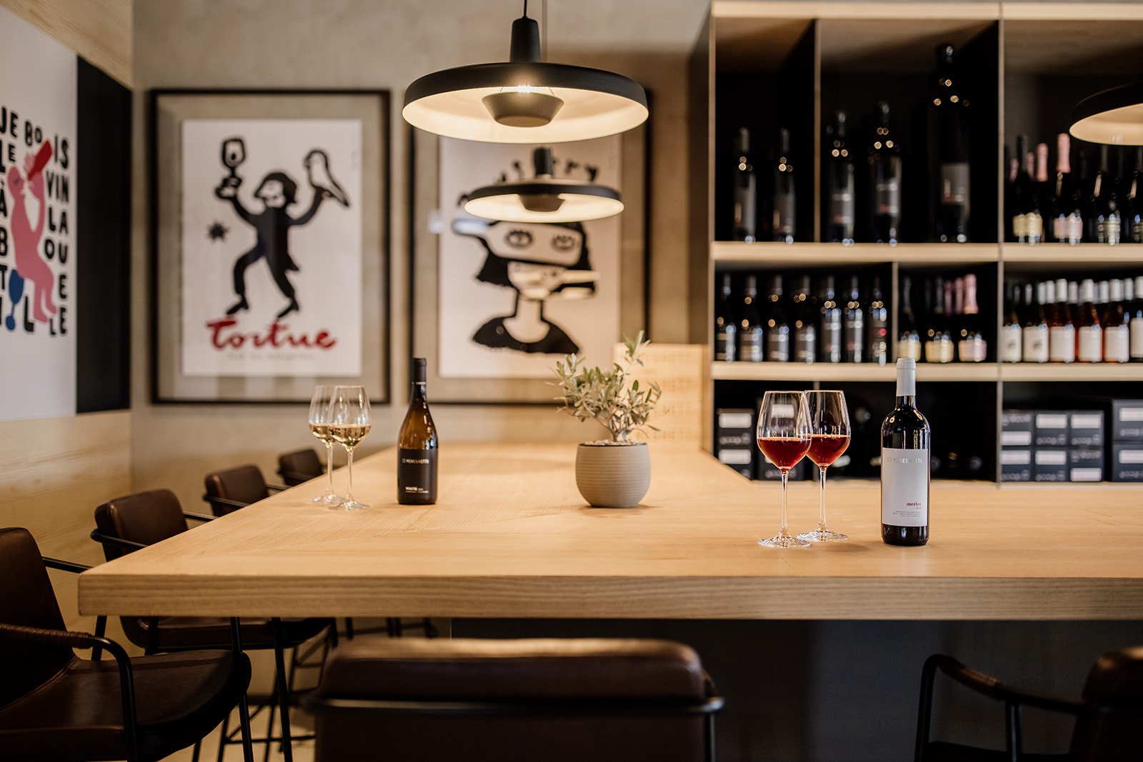The wine lounge, a long oak tasting bar lined with estate bottles