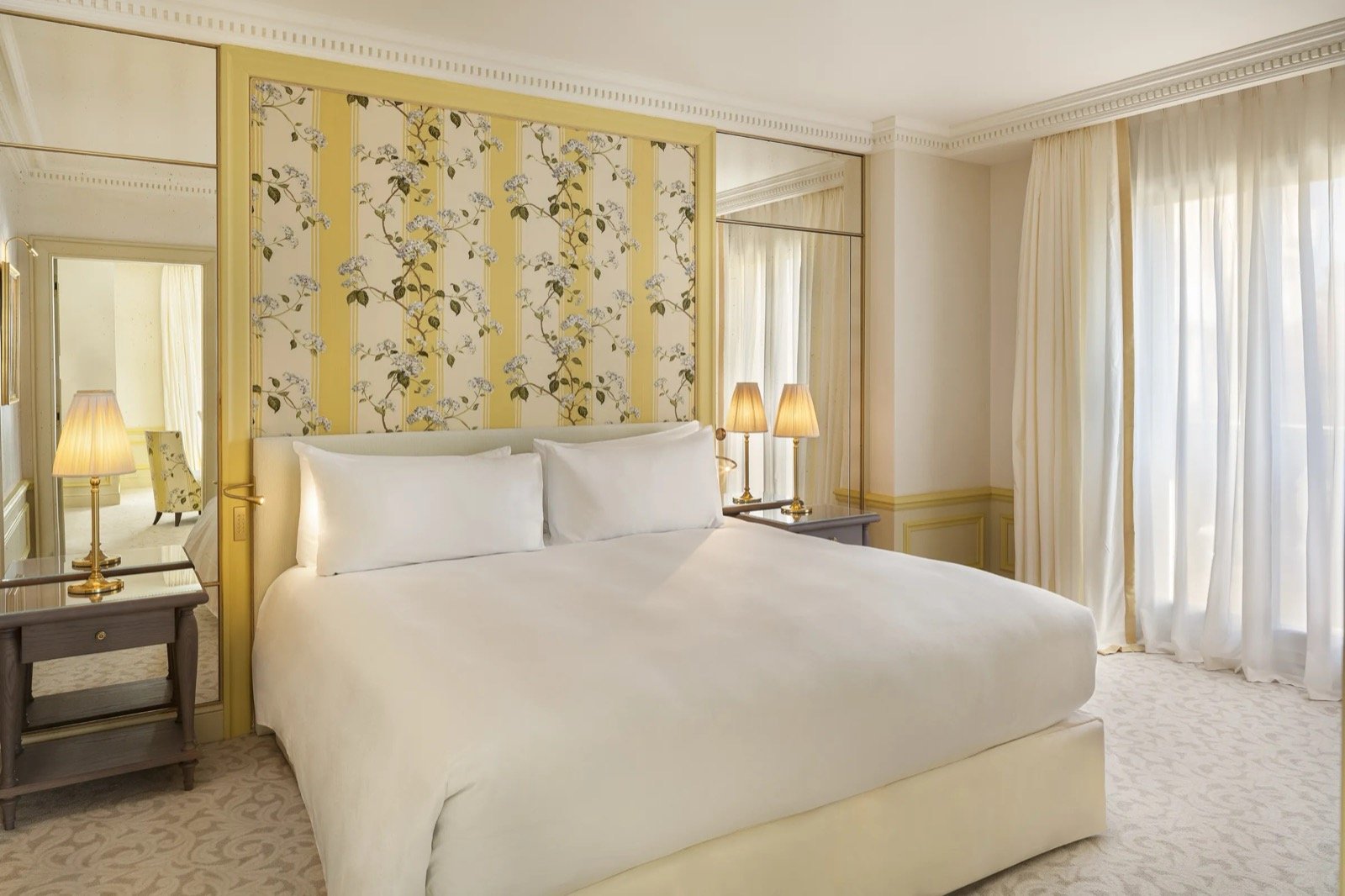 A suite bedroom dressed in Garcia's florals and soft colour