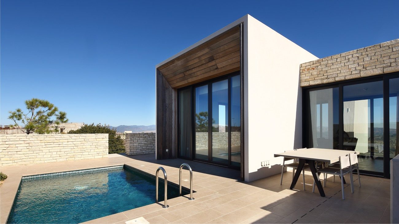 A Minthis suite with a private plunge pool and a view to the hills