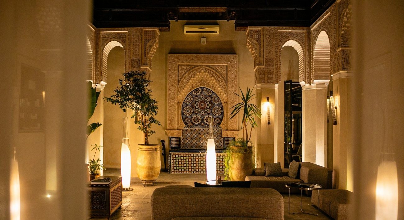 An Andalusian salon with carved plasterwork, lanterns and low seating