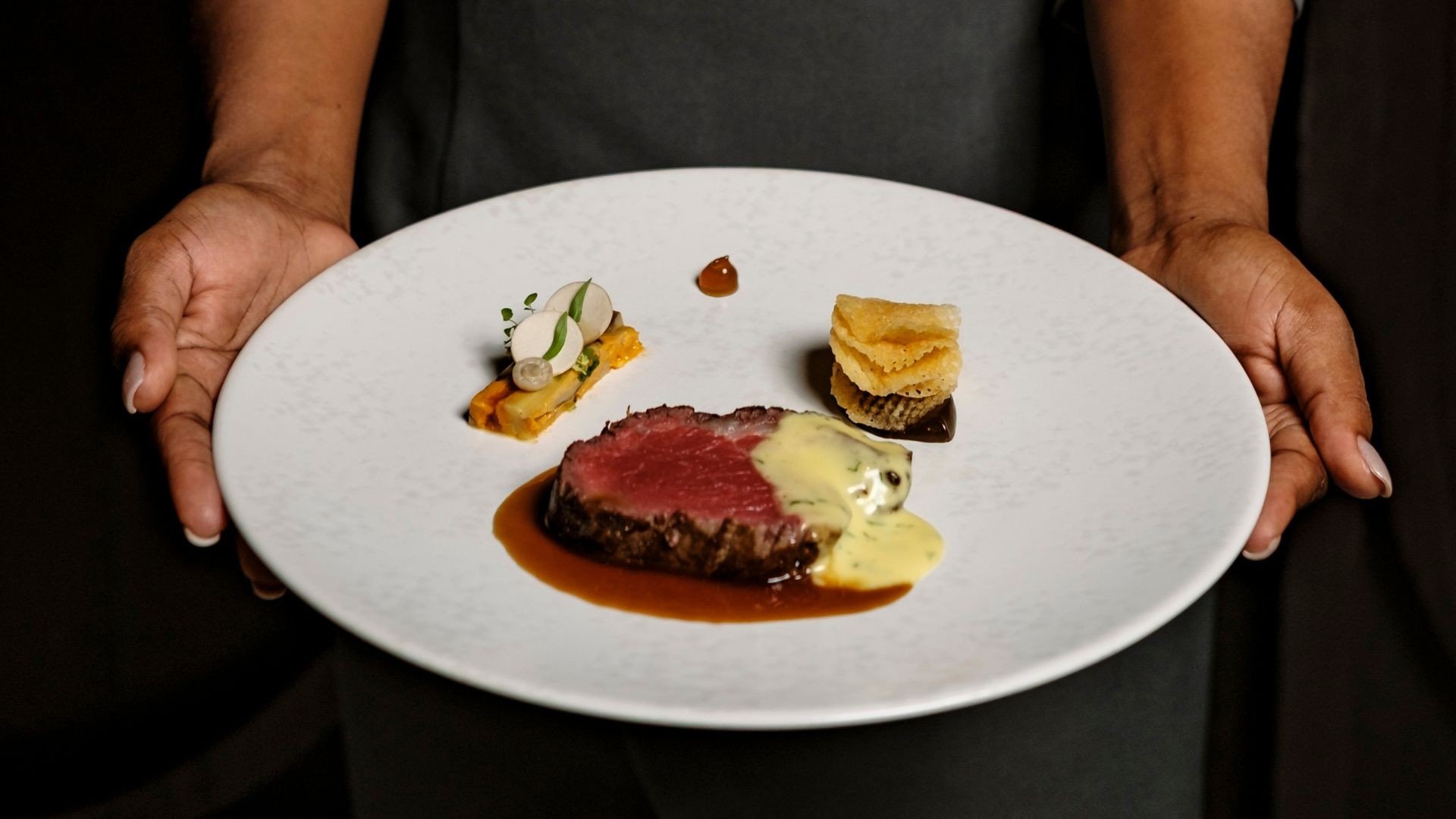 A plated course at Under Grain, the hotel's Michelin-starred cellar restaurant