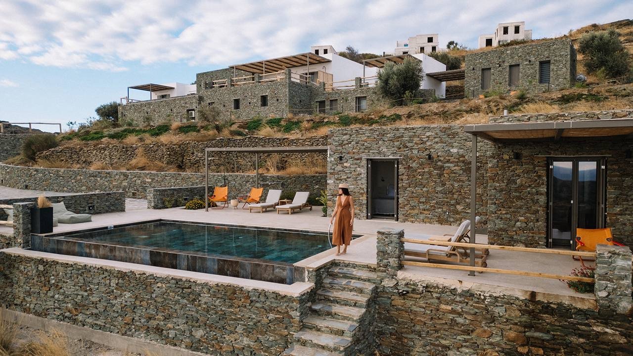 Stone residences terraced into the Sifnos hillside with private pool