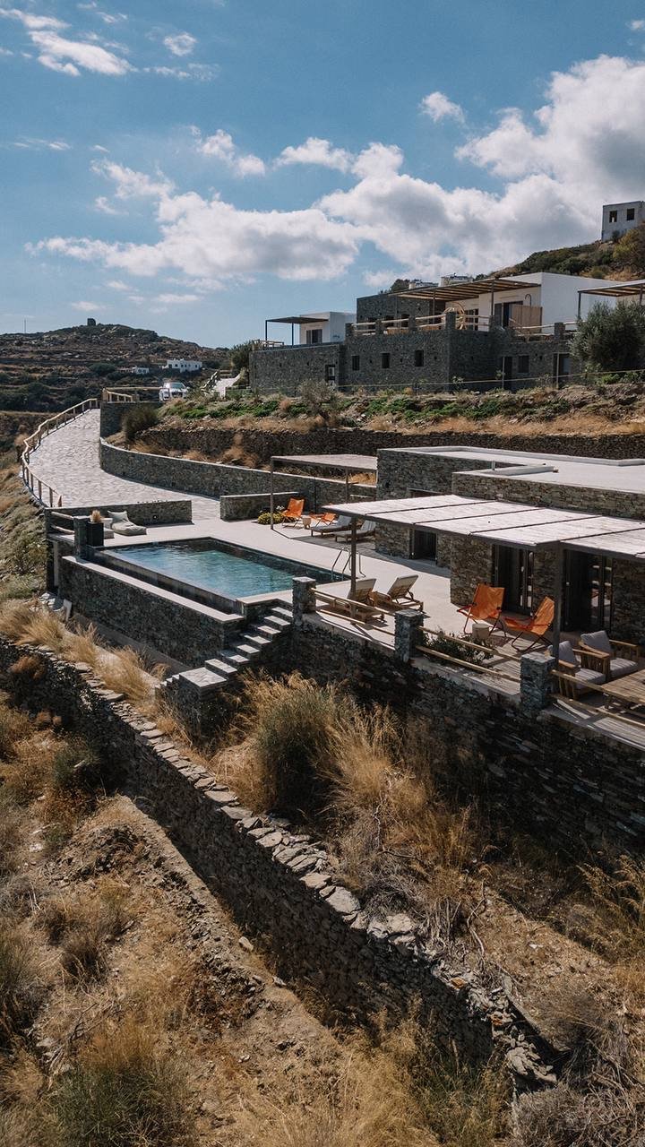 Pool terrace and loungers above the Sifnos landscape