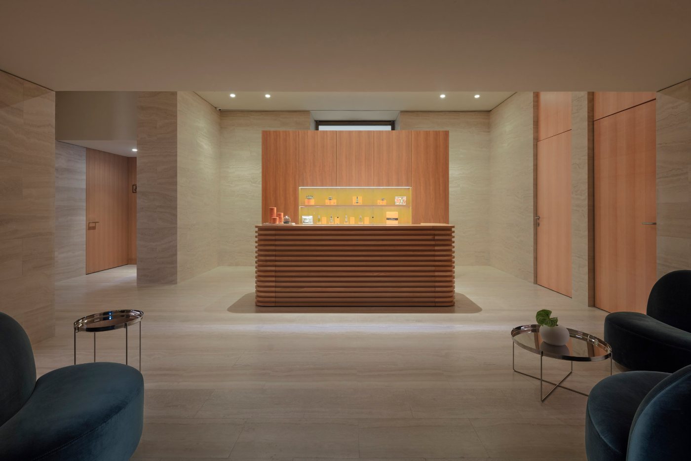 The spa, in pale stone and warm wood
