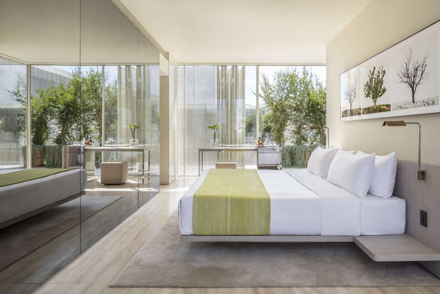 A suite in the modern wing, opening to a planted terrace