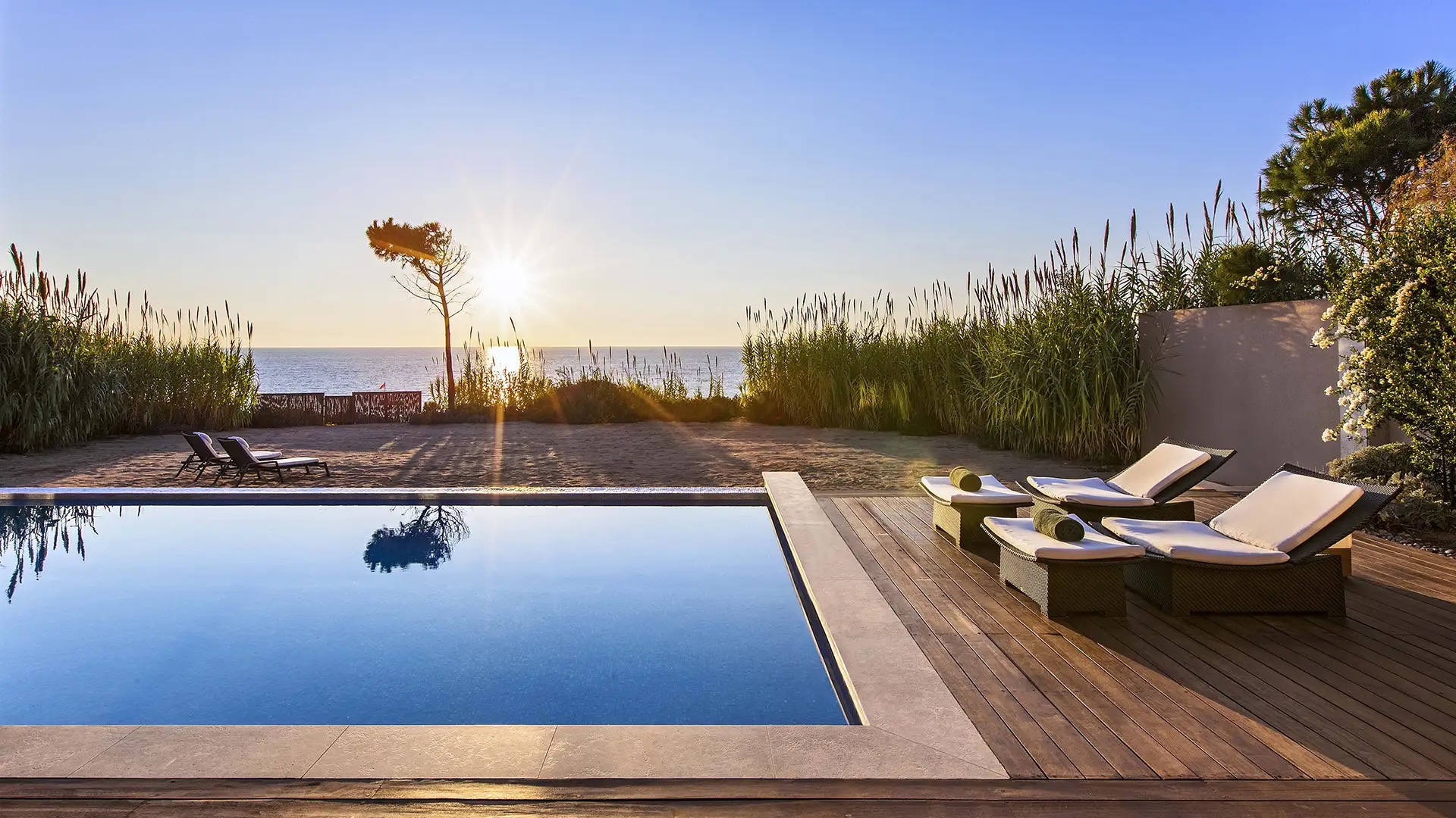 Private villa infinity pool at sunset, The Romanos